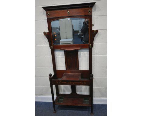 A 20TH CENTURY MAHOGANY AND MARQUETRY INLAID HALL STAND, with seven brass hooks, an arched mirror, a shelf, a hinged storage 