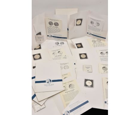 A CARDBOARD BOX OF FRANKLIN MINT HISTORY OF THE UNITED STATES SILVER COIN COLLECTION, to include Eisenhower 1990 Dollar, 1986
