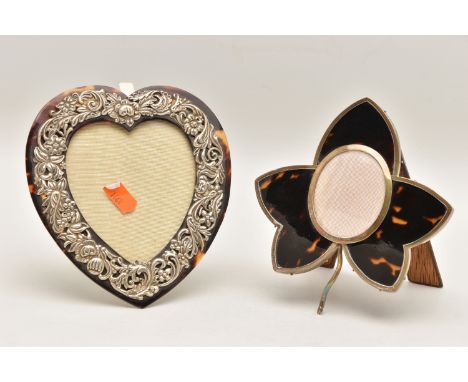 TWO SILVER AND TORTOISESHELL PHOTO FRAMES, the first a late Victorian heart shape frame with a silver floral pattern, fitted 