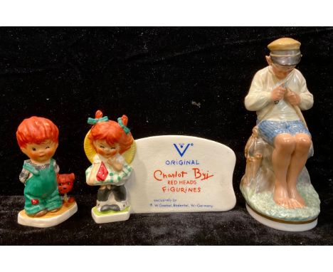 A Copenhagen figure, The Whittler; a Goebel Charlot Byi figural advertising stand; another figure, The Roving Eye (3) 