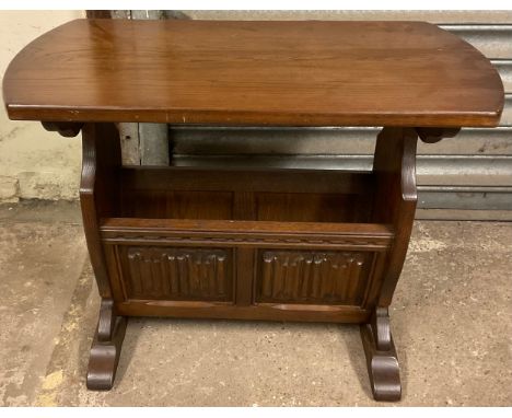 An Ercol magazine  side table,51cm high, 35cm wide 