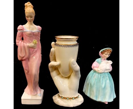 A Royal Worcester posy vase, modelled as a hand holding a vessel, the sleeve with gilt and turquoise bracelet cuff, 15cm, pri