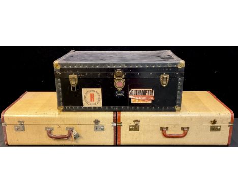 An early to mid 20th century steamer trunk, with various luggage labels including Peninsular &amp; Oriental Steam Navigation 