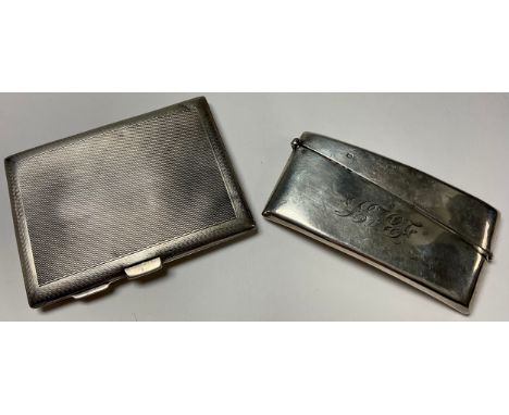 A George V silver rectangular cigarette case, engine turned, 9cm, EJ Trevitt &amp; Sons, Chester 1932, 61.8g; a George V silv