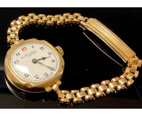 A 9ct gold lady's watch, white enamel dial with Arabic numerals, the case marked 375, Thomas Russell &amp; Son, with integral