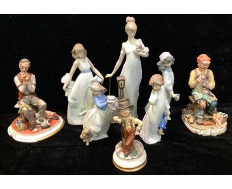 A Lladro figure, a lady holding a puppy holding an umbrella; another four Lladro and Nao figures; a Capodimonte figure, Tailo
