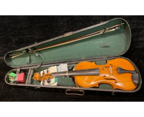 A concert violin and bow, Stradivarius label, wooden case 