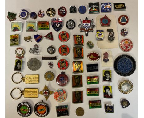 A collection of enamel and other badges, including Butlins, advertising, motor cycling, royal, rock and pop, etc, approximate