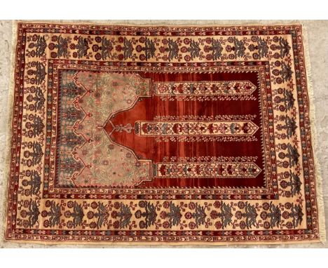 A Middle Eastern Persian woollen rug , the field with three  banded arrow, deep border of stylised flowerheads, on a rust and