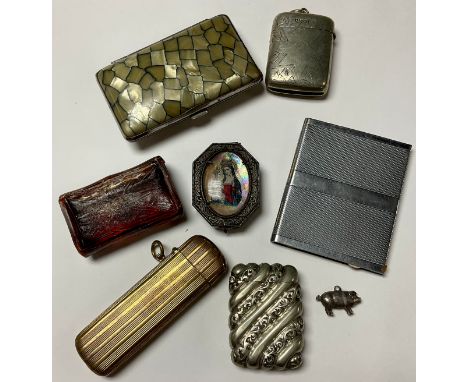 An EPNS vesta case, a brass engine turned vesta case, a base metal pill box with icon, a faux shagreen cigarette case,  other