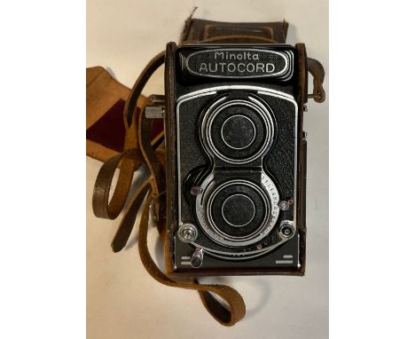 A Minolta Autocord twin lens camera, Chiyoko, Rokkor lenses, number 352578, brown stretched leather case, 16cm 