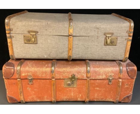 An early 20th century wooden bound steamer trunk, leather corner reinforcements and handles, 92cm wide; another similar (2) 