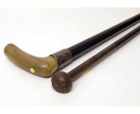 Walking stick with silver mount and a gun cleaning rod. Condition report: see terms and conditions