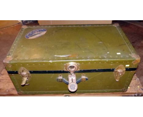Green travelling trunk by National Vulcanised Fibre Co. with Cunard White Star label and tag with "Baggage Master, S.S. Queen