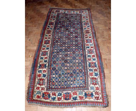 Middle Eastern carpet 116cm x 230cm. Condition report: see terms and conditions