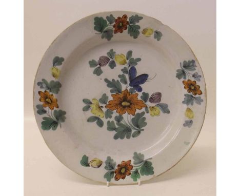 Tin glazed charger. Condition report: see terms and conditions. This lot is sold subject to V.A.T. Therefore £100 hammer pric