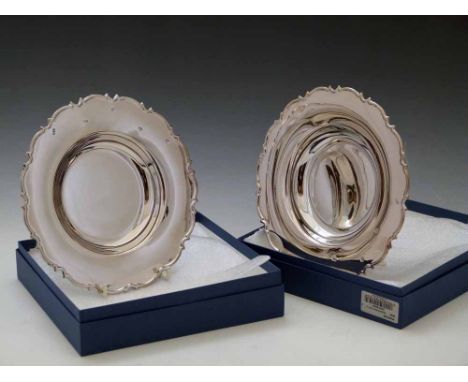 Two sterling silver 20cm plates, 2006, approx 300g each Condition report: see terms and conditions
This lot is sold subject t