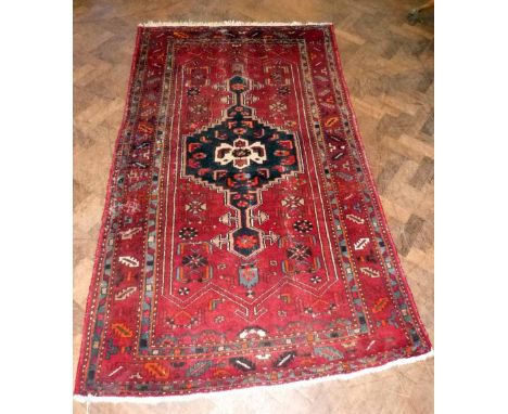 Middle Eastern carpet 133cm x 220cm. Condition report: see terms and conditions