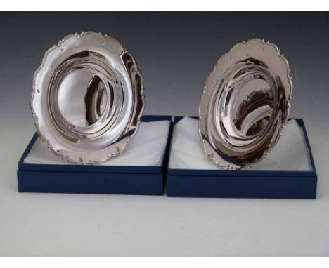 Two sterling silver 20cm plates, 2006, approx 300g each Condition report: see terms and conditions
This lot is sold subject t