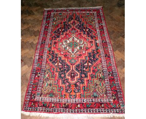 Middle Eastern carpet 140cm x 225cm. Condition report: see terms and conditions