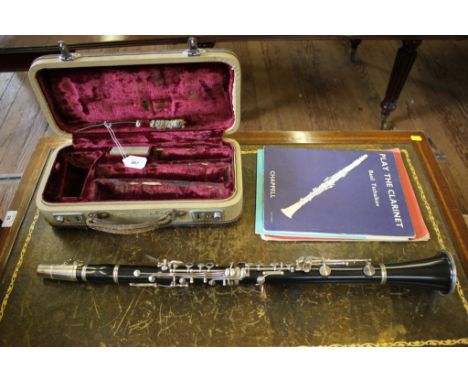 A clarinet 'The Model 41' by Lewington, London, numbered Q23609 with fitted case 68cm, and three books