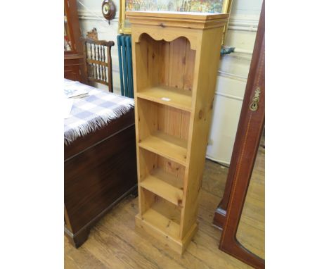 A pine book shelf unit 127cm high