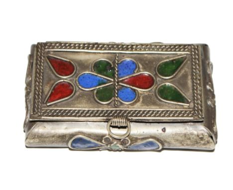 A small white metal snuff box decorated in enamel