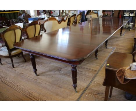 A large Early Victorian style mahogany banquet table, in the style of Gillows, the rectangular top with reeded edge over reed