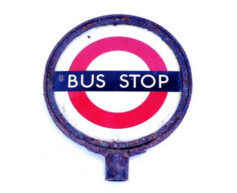 A cast iron framed circular exterior double sided LT enamel Bus Stop sign 