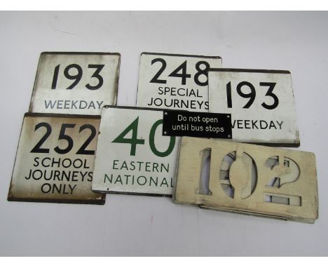 A quantity of enamel Bus front numbers and three stencil number plates