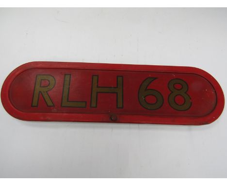 A red enamel number plate RLH 68