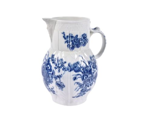 A Caughley blue and white printed 'Bouquets' pattern cabbage-leaf moulded mask jug, circa 1780, printed 'C' mark, 20cm high