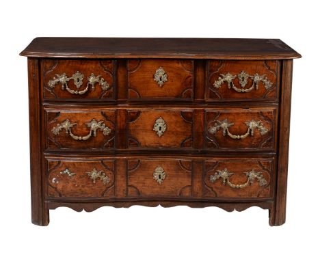 A provincial French walnut commode, mid 18th century, of double serpentine outline, with arrangement of three short and two l