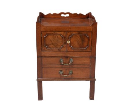 A George III mahogany night commode, circa 1780, the tray top incorporating carrying handles above pair of cupboard doors and