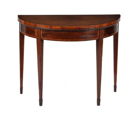 A George III mahogany and crossbanded card table, circa 1790, of semi-elliptical outline, 73cm high, 91cm wide, 46cm deep