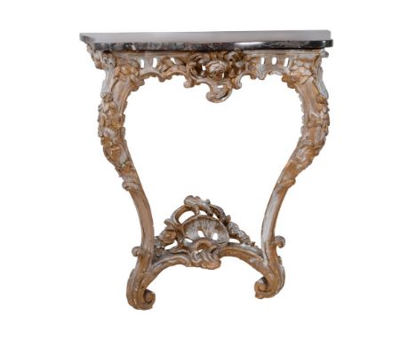 A carved giltwood and marble topped console table, 19th century, of serpentine outline, one rail with applied metal label LK8