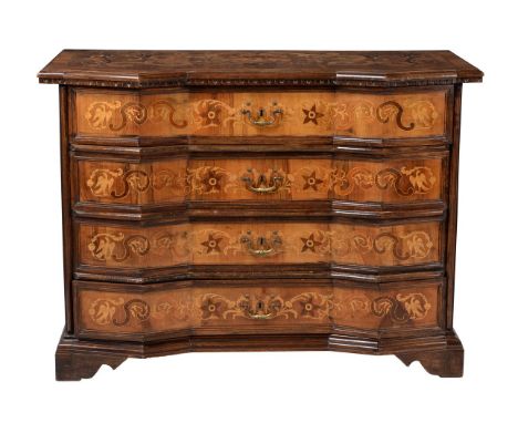 A Continental walnut and marquetry inlaid commode, late 18th century, probably South German or Italian, of angled serpentine 