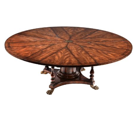 A flame mahogany extending dining table in William IV style, late 20th/early 21st century, probably retailed by Theodore Alex