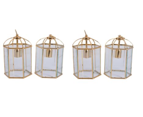 A set of four gilt metal and glazed hexagonal hall lanterns, second half 20th century, each with six domed supports rising to