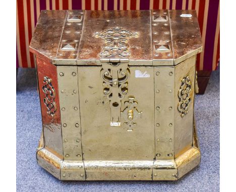 An Early 20th Century Brass Coal Box, with studded strap work and pierced appliques, 47cm by 35cm by 40cmClasp button with on