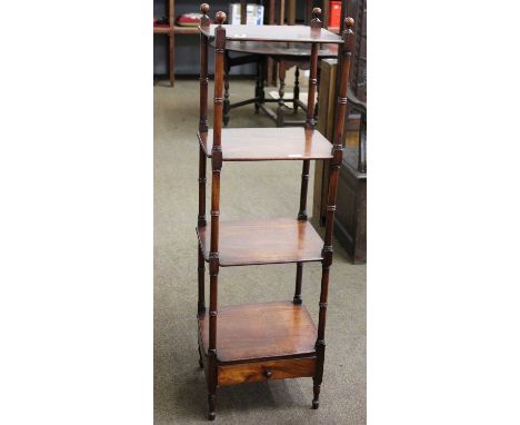 A Regency Mahogany Four Tier Whatnot, on ring turn supports and with single drawer, 40cm by 34cm by 129cm