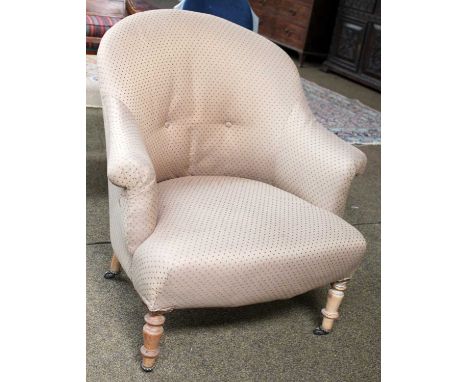 A Victorian Button Back Bedroom Chair, with turned legs and castors Measurements - 80cm high, 76cm wide, 55cm deep approximat