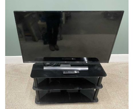 JVC SMART TV WITH REMOTE ON THREE-TIER BLACK GLASS STAND, 43-inch screen, model LT-43CF890, E/T, 61cms H, 97.5cms W and 50cms