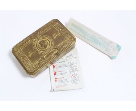 First World War Princess Mary Gift Tin together with a hold shield and needle in packets bearing S.A.S. Regimental stamp (2)