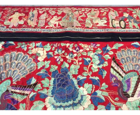 Chinese large embroidered red silk alter panel c19th century couch and satin stitch figures in garden scene, peacocks, butter