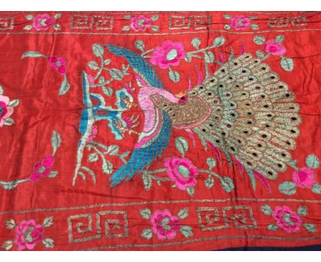 Chinese embroidered red silk vertical panel c1900s. Couch and satin stitches. Large peacock and flowers, scrolling foliage an