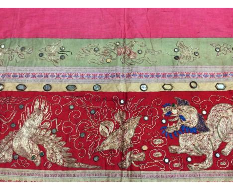 Chinese embroidered and mirrored red silk panel c.19th century with couch and satin stitches, lion, pheasant. Embroidered and