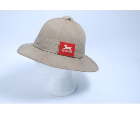 Second World War British Army Foreign Service pith helmet, with leather headband and flash for the West Yorkshire Regiment