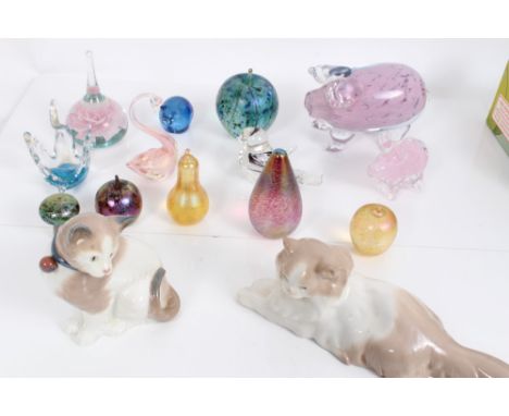 Three Nao porcelain cats and a collection of 13 glass paperweights including Isle of Wight and Alum Bay