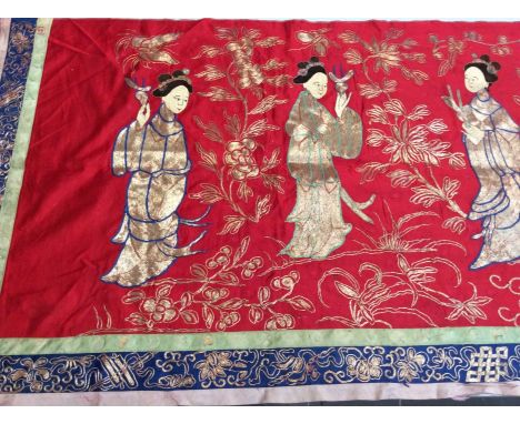 Chinese long embroidered red silk panel c1900s couch and satin stitch, figures in garden scene with altar. Embroidered silk b